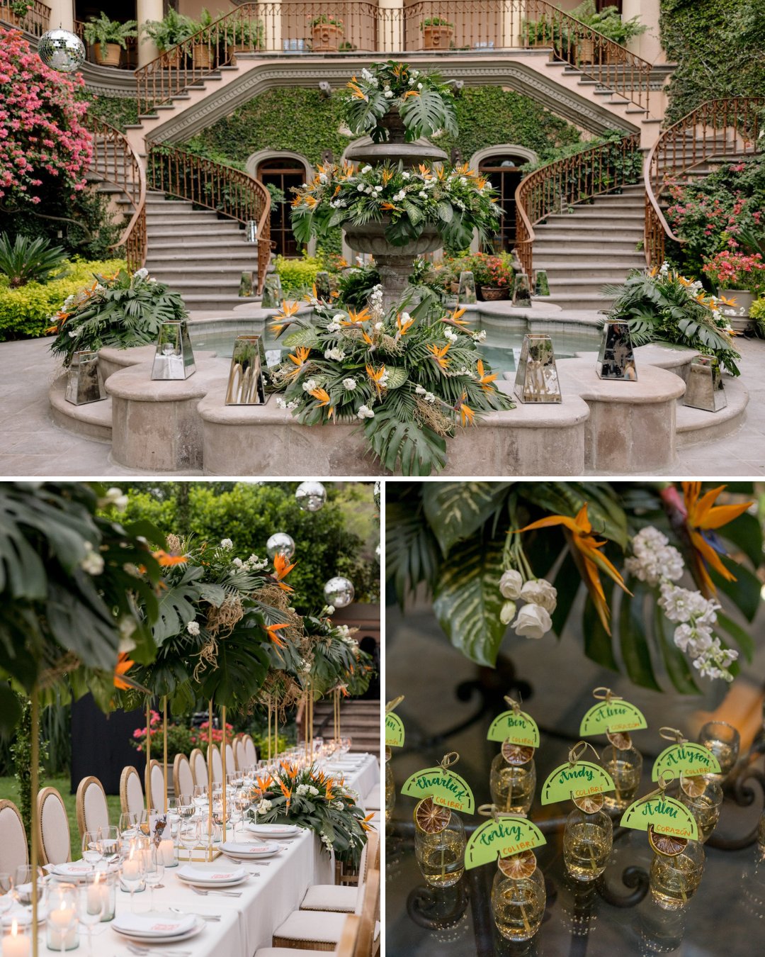 An elegant courtyard with a central fountain, curved stairs, lush greenery, decorated dining table, and small gold skull place cards labeled with green leaves.